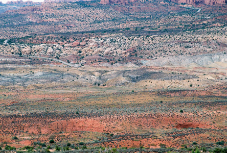 [Close up of land atop salt valley.]